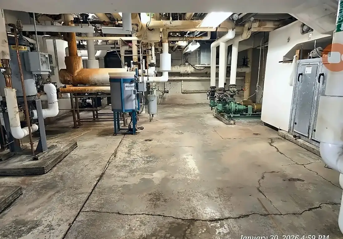 Cracked mechanical room slab before coating